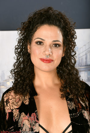 1 dark haired female tortures another during lezdom play in concrete cellar